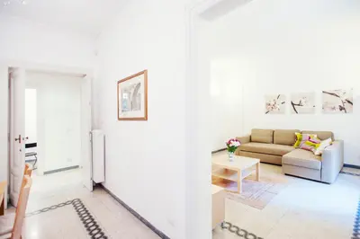 a white living room with a couch and a table at Palestrina in Rome