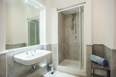 a bathroom with a sink and a shower at S.Andrea in Rome