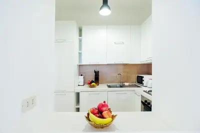 a kitchen with a bowl of fruit on a counter at S.Andrea in Rome