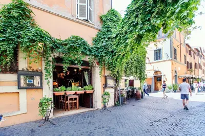 a street in an old town with a shop at Lungaretta3 in Rome