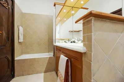 a bathroom with a shower and a sink and a mirror at Lungaretta3 in Rome