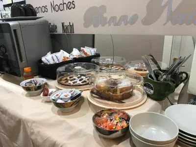 a table topped with different types of food at Morgagni House in Rome