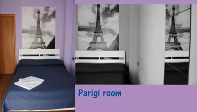 a bedroom with a bed with a picture of the eiffel tower at La Quiete in Rome