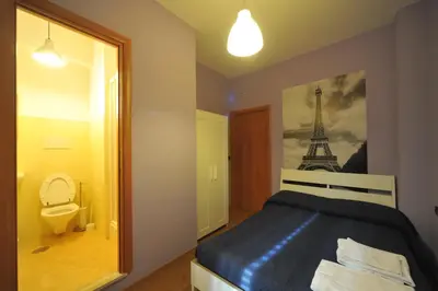 a bedroom with a bed with the eiffel tower at La Quiete in Rome