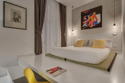 a living room with a couch and a table at Navona Theatre Hotel in Rome