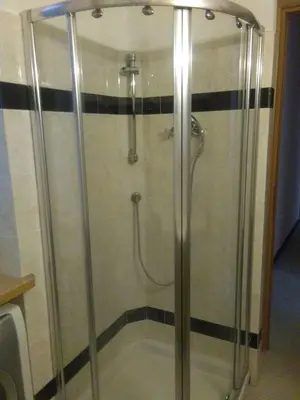 a shower with a glass door in a bathroom at FamilyBed Roma Monteverde-Vaticano in Rome