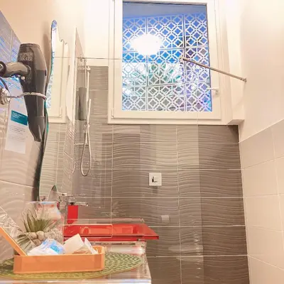a kitchen with a window and a sink at Tama Rooms in Rome