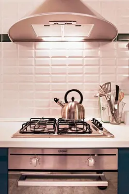 a tea kettle sitting on top of a stove in a kitchen at TrastevereHome - Sales Rome in Rome
