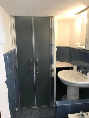 a bathroom with a shower and a sink at Guest House Laocoonte in Rome