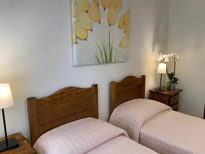 two beds sitting next to each other in a bedroom at Guest House Laocoonte in Rome