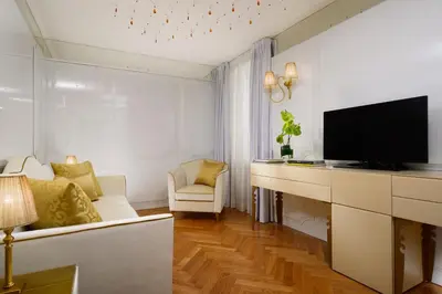 a living room with a flat screen tv and a couch at Lifestyle Suites Rome in Rome