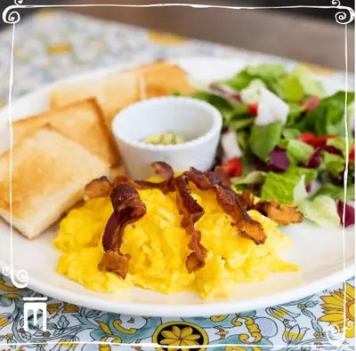 a plate of food with eggs and bacon and a salad at Residenza Maritti ContemporarySuite - Guesthouse in Rome