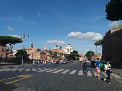 an empty street in an alley between two buildings at Frangipane Apartment in Rome