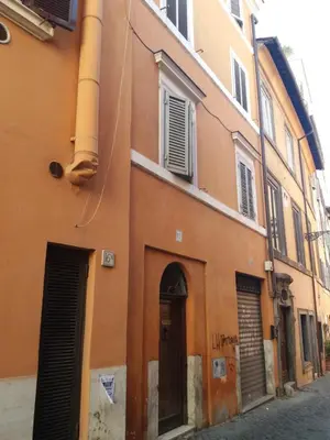 a group of people standing outside of a building at Frangipane Apartment in Rome