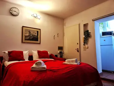 a living room with a couch and a table at Frangipane Apartment in Rome
