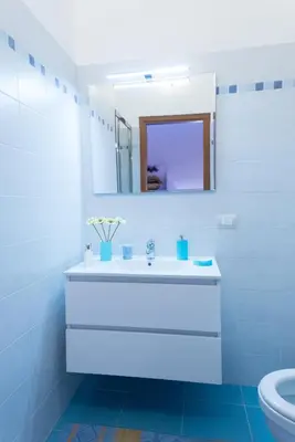 a bathroom with a white sink and a mirror at Vatican Art Place in Rome