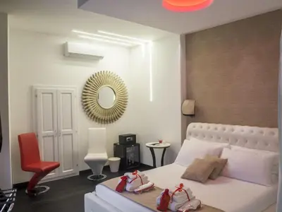 a bedroom with a bed with shoes on it at Navona Living Rome in Rome