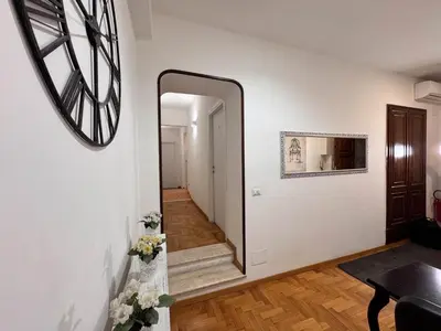 a mirror on the wall of a hallway with stairs at Ripetta 35 in Rome
