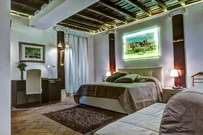 a bedroom with a bed and a television in it at Good Life Monti in Rome