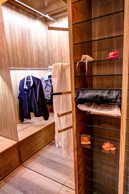 a walk in closet with wood paneling and towels at Good Life Monti in Rome