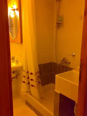 a bathroom with a shower and a tub and a sink at Da Anita in Rome