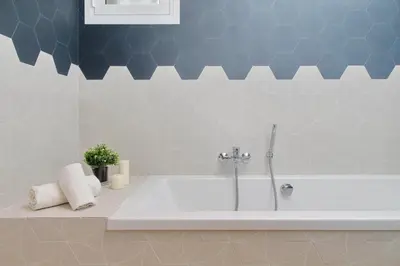a bathroom with a bath tub with a sink at Il Villino di Adelchi by DomusDimore in Rome