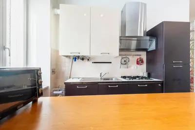 a kitchen with a sink and a stove at Casa Elena - ItalyHolidayHouse in Rome