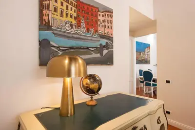 a desk with a lamp on it in a room at Avila Palace Piazza Navona in Rome