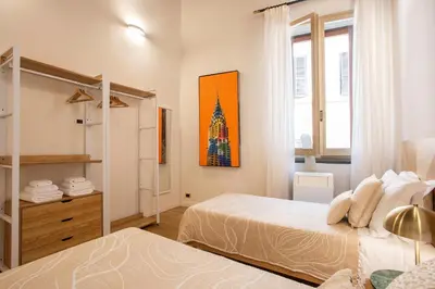 a bedroom with two beds and a window at Avila Palace Piazza Navona in Rome