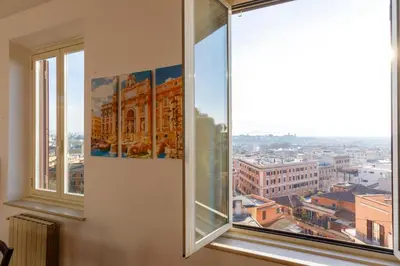 an open window with a view of a city at La Dolce Vista Trastevere in Rome
