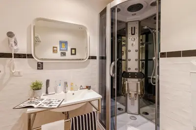 a bathroom with a sink and a shower at Athena Guest House in Rome