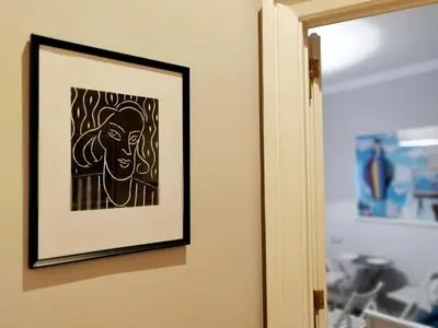 a framed picture of a man hanging on a wall at Athena Guest House in Rome