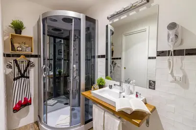 a bathroom with a shower and a sink at Athena Guest House in Rome