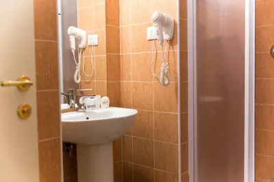 a bathroom with a sink and a shower at Best Suites Pantheon in Rome