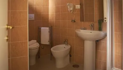 a bathroom with a toilet and a sink at Best Suites Pantheon in Rome