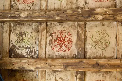 a wooden wall with red and green designs on it at Best Suites Pantheon in Rome