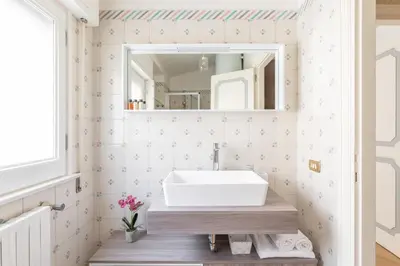 a bathroom with a sink and a mirror at Town House Roma in Rome