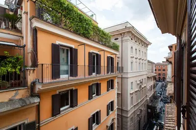 an alley in the city with buildings at Town House Roma in Rome