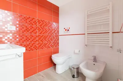 a bathroom with a toilet and a sink at Un Passino da San Pietro Casa in Rome