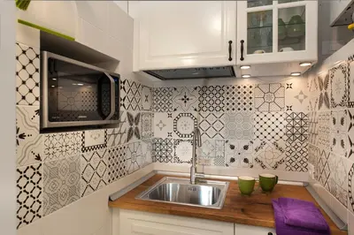 a kitchen with a sink and a microwave at FL Apartments Charming Flat in the heart of Trastevere in Rome