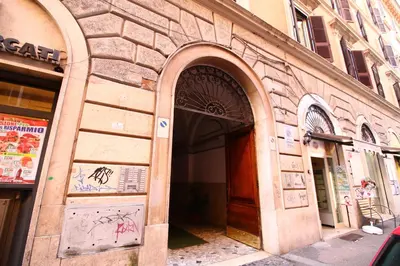 a building with an archway on the side of it at Magenta Collection Del Grande in Rome