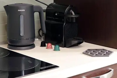 a coffee maker sitting on top of a counter at Nancy Bleisure Suite by DomusDimore in Rome