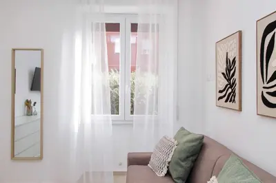 a living room with a couch and a window at Nancy Bleisure Suite by DomusDimore in Rome