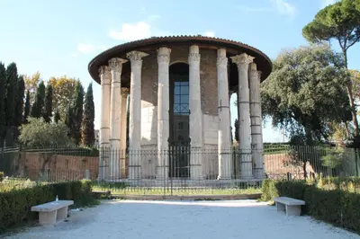 a building with two benches in front of it at Domus Farnese in Rome