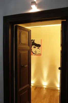 a room with a door and a painting on the wall at Rome Armony Suites in Rome
