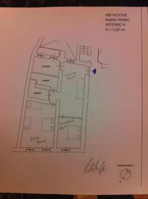 a drawing of a floor plan on a whiteboard at Piazza Farnese in Rome