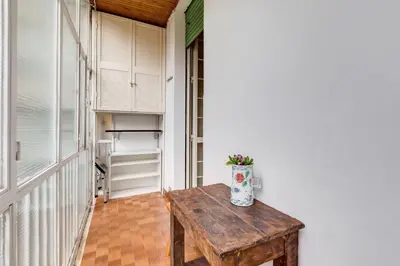 a hallway with a wooden table in a room at Casa Vacanza Home Sweet Home di Fatha in Rome