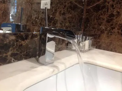 a bath tub with a water fountain in a bathroom at Le case di Andrea - Roof Suite Rome in Rome