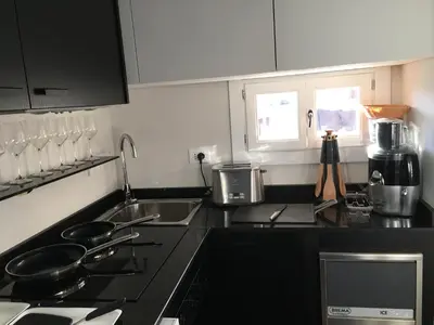 a kitchen with a sink and a stove top oven at Le case di Andrea - Roof Suite Rome in Rome