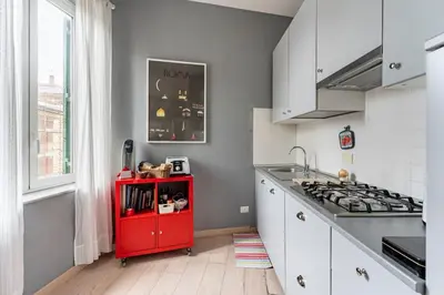 a red cabinet in a kitchen with a stove at Walking to Trastevere di Marialaura Aragno in Rome